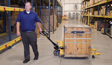 Man Pulling Material with a CAT Hand Pallet Jack